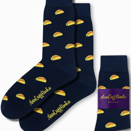 Navy blue Taco Socks feature vibrant yellow taco designs and the brand name "AusCufflinks." They come with a purple label that reads "AusCufflinks Australia," injecting a fun element into any ensemble.