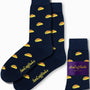 Navy blue Taco Socks feature vibrant yellow taco designs and the brand name "AusCufflinks." They come with a purple label that reads "AusCufflinks Australia," injecting a fun element into any ensemble.