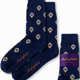 A pair of "Watch Socks" in navy blue, adorned with stylish watch patterns, prominently displays the "AusCufflinks" branding on the side. One sock is folded next to the pair, offering a timeless style that enhances your wardrobe with a touch of sophistication.