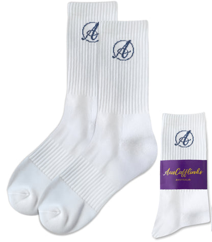 AusCufflinks Socks are premium white cotton dress socks featuring a blue "A" logo near the top, shown alongside packaging labeled "AustCufflinks Australia," perfect for adding a refined touch to any formal outfit.