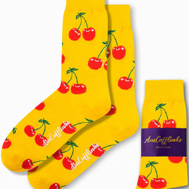 The Cherry Socks offer a charming style with their yellow color and red cherry patterns, and they feature a label reading "AusCufflinks Australia.