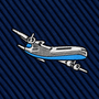The Aeroplane Skinny Tie features an embroidered illustration of an airplane in blue, black, and white thread on a dark blue, diagonally-ribbed fabric—perfect for adding a distinctive aviation touch to your pilot necktie collection.