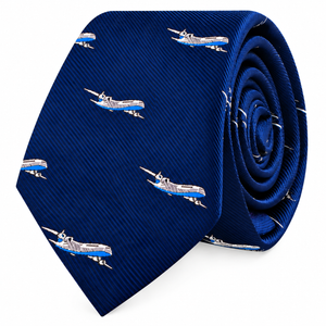Aeroplane Skinny Tie in blue, showcasing a repeating pattern of small white and blue airplanes, elegantly displayed against a plain white background.