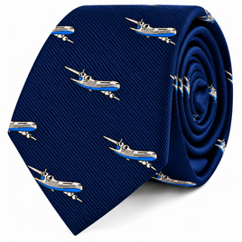 Introducing the Aeroplane Skinny Tie, featuring a rolled-up blue design adorned with a repeating pattern of white and blue commercial airplanes across the fabric.