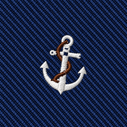 The Anchor Skinny Tie features an embroidered white anchor with a brown rope, centered on a blue fabric background with diagonal stripes, making it the ideal accessory for anyone looking for a classic nautical touch at a wedding.