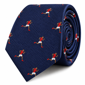 Introducing the Athletics Skinny Tie, a navy blue necktie adorned with a repeating pattern of sprinters in red shirts, white shorts, and red shoes—making it an ideal sports-themed accessory and a thoughtful gift for runners.