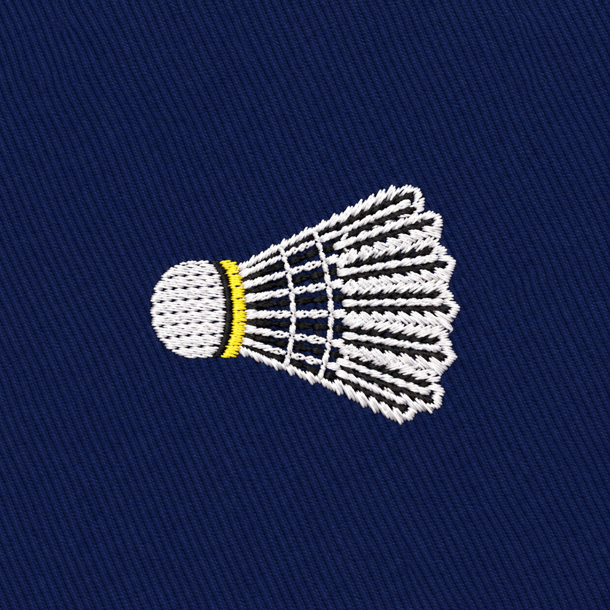 The Badminton Skinny Tie features embroidered white badminton shuttlecocks with yellow accents on a dark blue fabric background, making it the perfect novelty accessory for badminton enthusiasts.