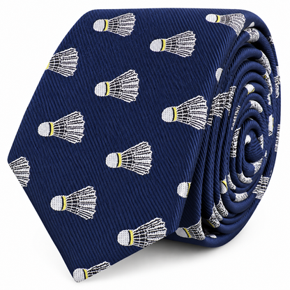 The Badminton Skinny Tie is a navy blue novelty accessory featuring a repeating pattern of embroidered white and yellow shuttlecocks—perfect for badminton enthusiasts seeking a fun shuttlecock print.