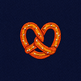 Bagel Skinny Tie featuring an embroidered bagel with salt on a dark blue fabric background—perfect for food lovers seeking a unique and playful accessory.