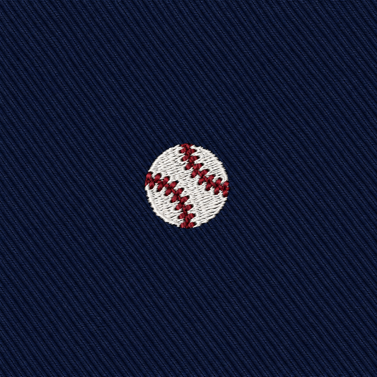 The Baseball Skinny Tie features an embroidered white baseball with red stitching, centered on a dark blue fabric background—perfect as a groomsmen accessory or a unique gift for any baseball fan.