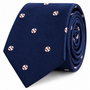 Certainly! Here’s the rewritten sentence using your product data: The Baseball Skinny Tie is a rolled navy blue necktie featuring a subtle textured pattern, accented with small embroidered white baseballs with red stitching—an ideal gift for baseball fans or a stylish accessory for sporting events.