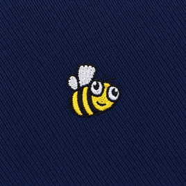 Featuring an embroidered cartoon bee with yellow and black stripes, white wings, and a smiling face on dark blue fabric, the Bee Skinny Tie adds playful character to any wardrobe.