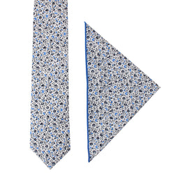 A Black Light Blue Floral Cotton Skinny Tie & Pocket Square Set set against a Midnight backdrop.