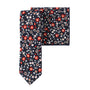 An elegant set consisting of a floral skinny tie and pocket square, highlighted by its Black Red Orange Amaryllis-inspired pattern.