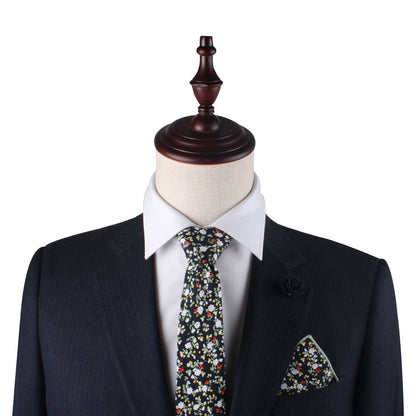 A black suit with a Black Red Yellow Multi Cotton Floral Skinny Tie & Pocket Square Set.