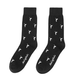 Golf Swing Black Socks—black novelty socks with small white seahorse patterns and "Lucky Me, I See Ghosts" near the toes; a quirky golf gift ideal for any enthusiast.