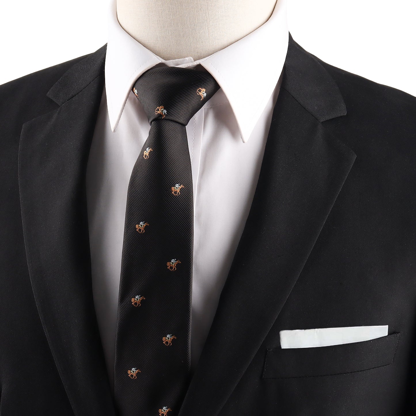 A person in a black suit jacket and white shirt, styled with the Horse Racing Skinny BLACK Tie featuring small embroidered designs, and a white pocket square in the jacket pocket.