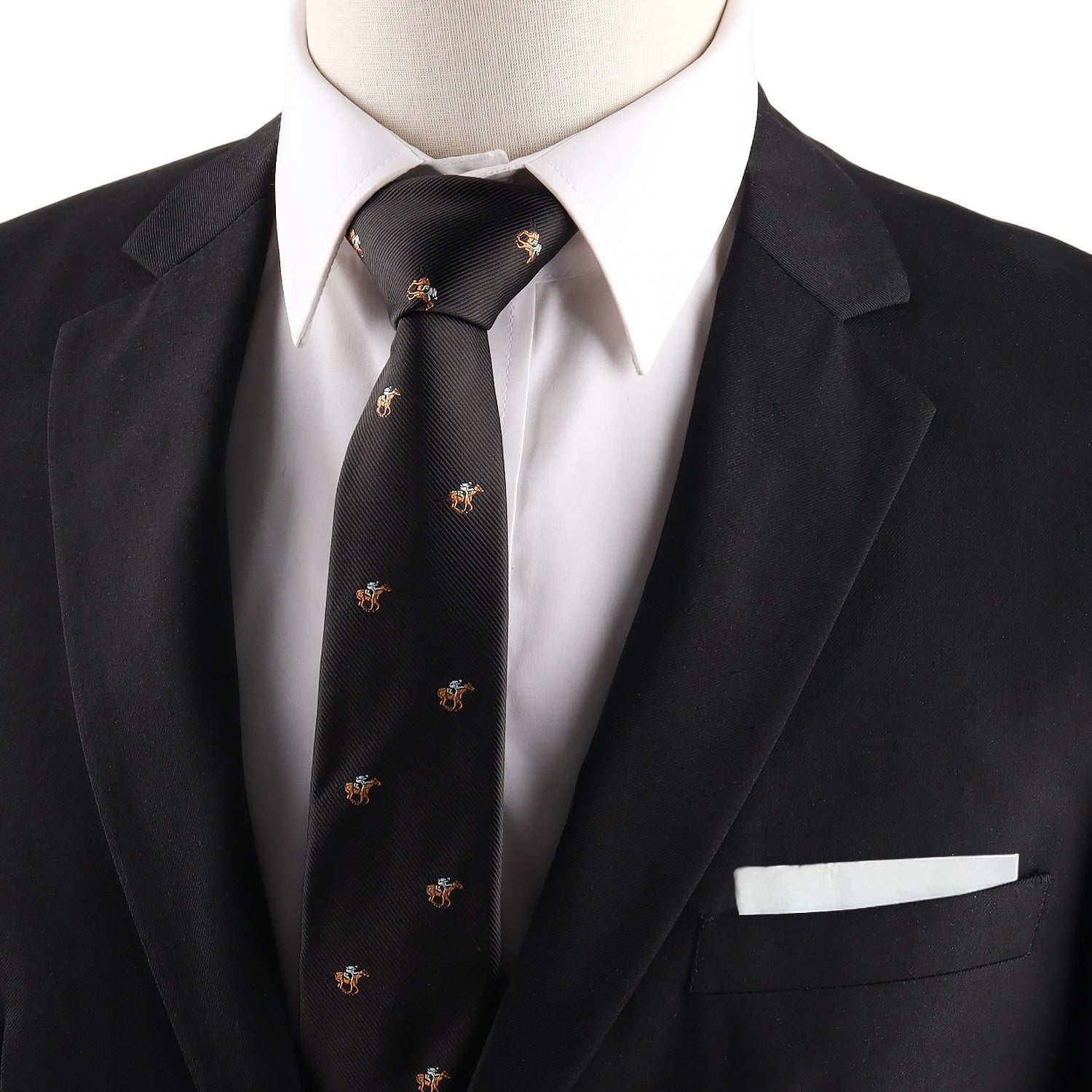 A person in a black suit jacket and white shirt, styled with the Horse Racing Skinny BLACK Tie featuring small embroidered designs, and a white pocket square in the jacket pocket.