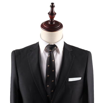 Mannequin dressed in a black suit jacket, white dress shirt, Horse Racing Skinny BLACK Tie with small patterns, and a white pocket square against a plain background.