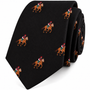 The Black Thoroughbred Racing Horse Skinny Tie showcases a repeating pattern of embroidered jockeys riding brown horses, each adorned with red helmets and blue, green, and white outfits—making it an ideal equestrian accessory for any horse racing enthusiast seeking a distinctive tie.