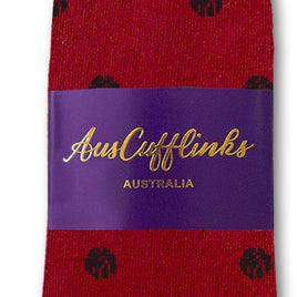 A single blue basketball sock featuring cushioned support and packaged with a purple AusCufflinks Australia label.