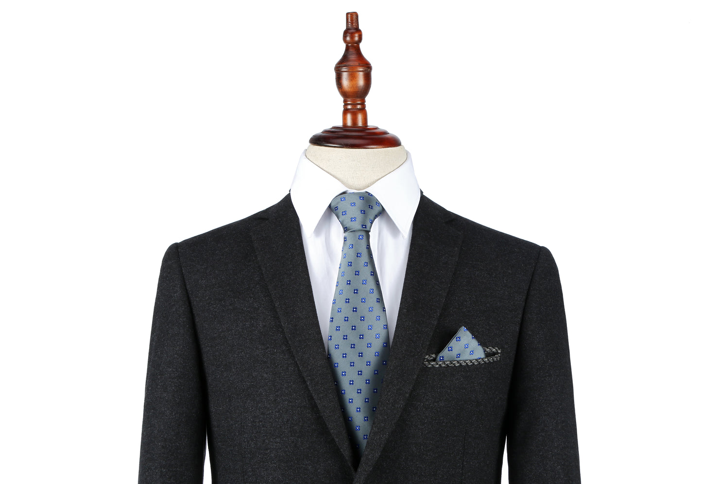 A mannequin dressed in a dark suit, white shirt, and a Blue Flower Grey Business Tie & Pocket Square Set.