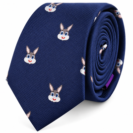 The Bunny Skinny Tie is a rolled blue novelty skinny tie decorated with a repeating pattern of cartoon rabbit faces, complete with big eyes, pink ears, and cheerful smiles. This playful accessory adds a fun animal print element to your outfit.