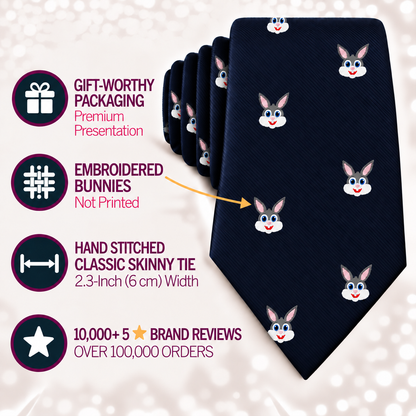 The Bunny Skinny Tie in navy blue features embroidered bunny faces and is showcased with icons and text highlighting its premium packaging, hand stitching, 2.3-inch width, and more than 10,000 five-star reviews.