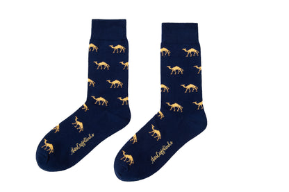 AusCufflinks’ Camel Socks are navy blue with a yellow giraffe pattern and cursive text by the toes—an ideal animal lover gift.