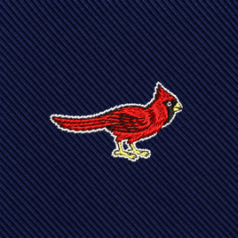 Featuring an embroidered red cardinal bird set against a dark blue, diagonal-striped fabric background, the Cardinal Bird Skinny Tie makes an ideal addition to any wildlife-inspired fashion collection.