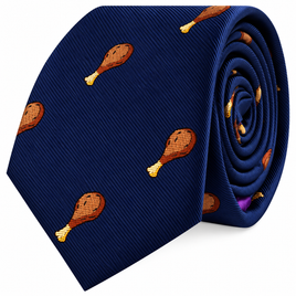 The Chicken Skinny Tie is a blue necktie featuring a playful pattern of small cooked drumsticks scattered across the fabric—an eye-catching design that adds a touch of fun to any outfit.