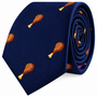 The Chicken Skinny Tie is a blue necktie featuring a playful pattern of small cooked drumsticks scattered across the fabric—an eye-catching design that adds a touch of fun to any outfit.