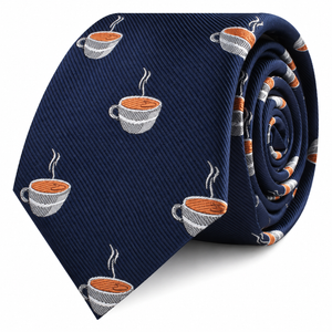 The Coffee Skinny Tie is a navy blue tie featuring a repeating pattern of steaming coffee cups, embroidered in white, brown, and gray.