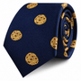 Presenting the Cookies Skinny Tie, a navy blue skinny tie featuring a playful pattern of yellow cookie-like circles, displayed rolled up on a white background.