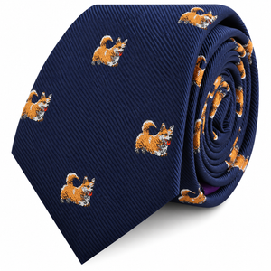 The Corgi Dog Skinny Tie features a navy blue background with a repeating pattern of small, embroidered orange corgi dogs—making it the perfect novelty accessory and an ideal gift for any dog lover.