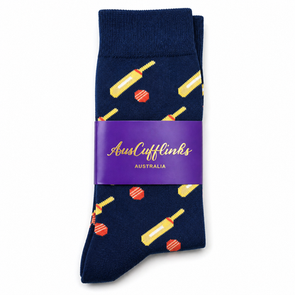 Cricket Bat & Ball Socks: Navy blue premium cotton socks with yellow cricket bat and red ball patterns, packaged with a purple "AussieCufflinks Australia" label.