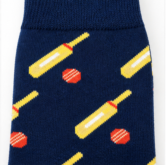 The Cricket Bat & Ball Socks feature navy blue fabric with yellow bats and red balls, crafted from premium cotton for comfort and style.