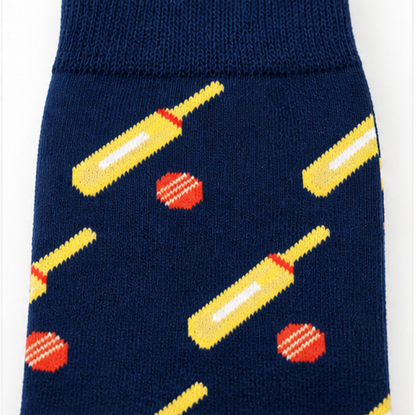 The Cricket Bat & Ball Socks feature navy blue fabric with yellow bats and red balls, crafted from premium cotton for comfort and style.