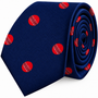 A rolled-up Cricket Skinny Tie in navy blue featuring a pattern of red cricket balls—an ideal cricket gift for any enthusiast.