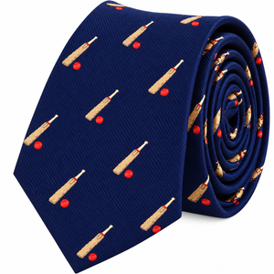 A tightly rolled Cricket Bat and Ball Skinny Tie in navy blue, featuring a pattern of small cricket bats and red cricket balls.