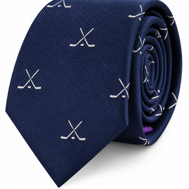 Presenting the Crossed Ice Hockey Skinny Tie: a navy blue tie adorned with a pattern of crossed white hockey sticks, shown rolled neatly against a white background—an ideal sports accessory for any dedicated fan.