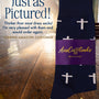 A pair of navy "Jesus The Redeemer Socks" with white cross patterns, wrapped in a purple "AussieCufflinks AUSTRALIA" label, displayed inside a church.