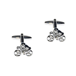 The Cyclist Cufflinks are expertly crafted from polished metal and feature cyclists on bicycles against a white background, capturing the spirit of pedal power.
