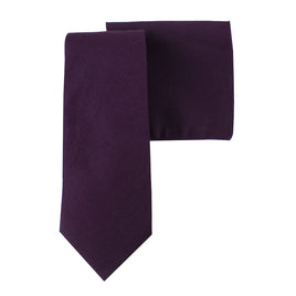The Dark Purple Cotton Skinny Tie & Pocket Square Set makes a stylish statement, with the tie laid flat and ideal for pairing with its matching pocket square.