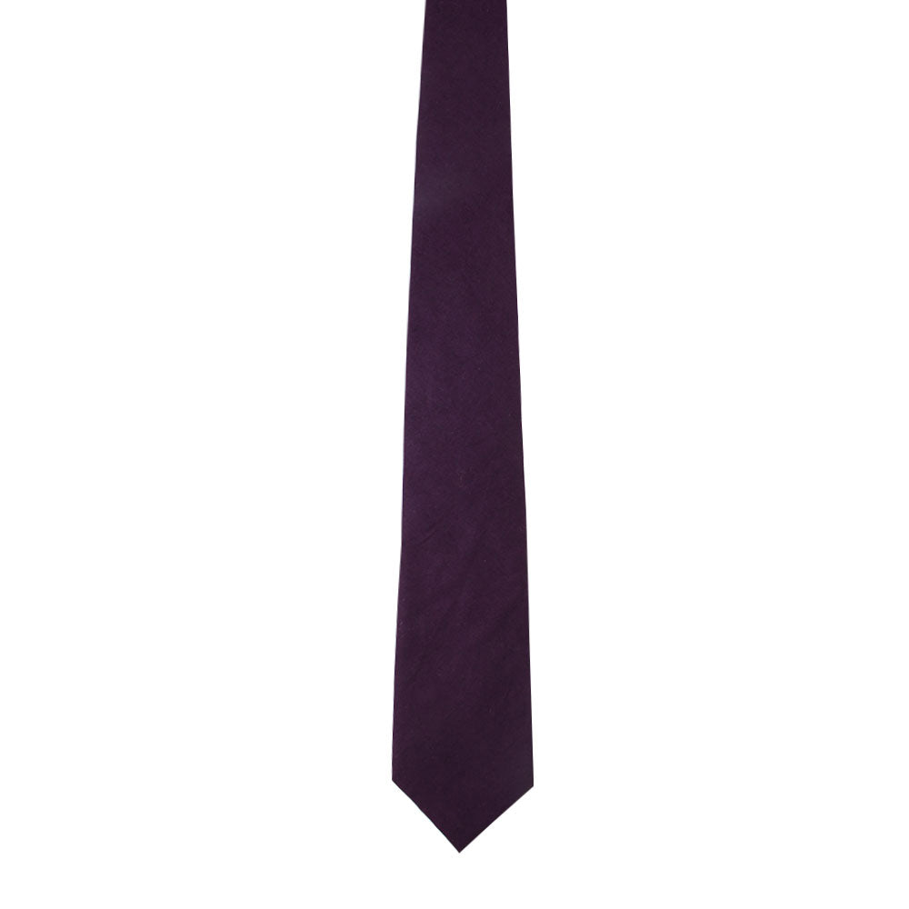 The Dark Purple Cotton Skinny Tie & Pocket Square Set, made of cotton with a smooth texture, is elegantly displayed on a plain white background.