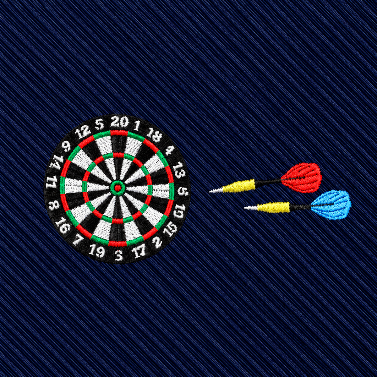 The Darts Skinny Tie features an embroidered dartboard with two darts—one red and one blue—set against a dark blue diagonal striped fabric, making it the perfect gift for darts lovers.