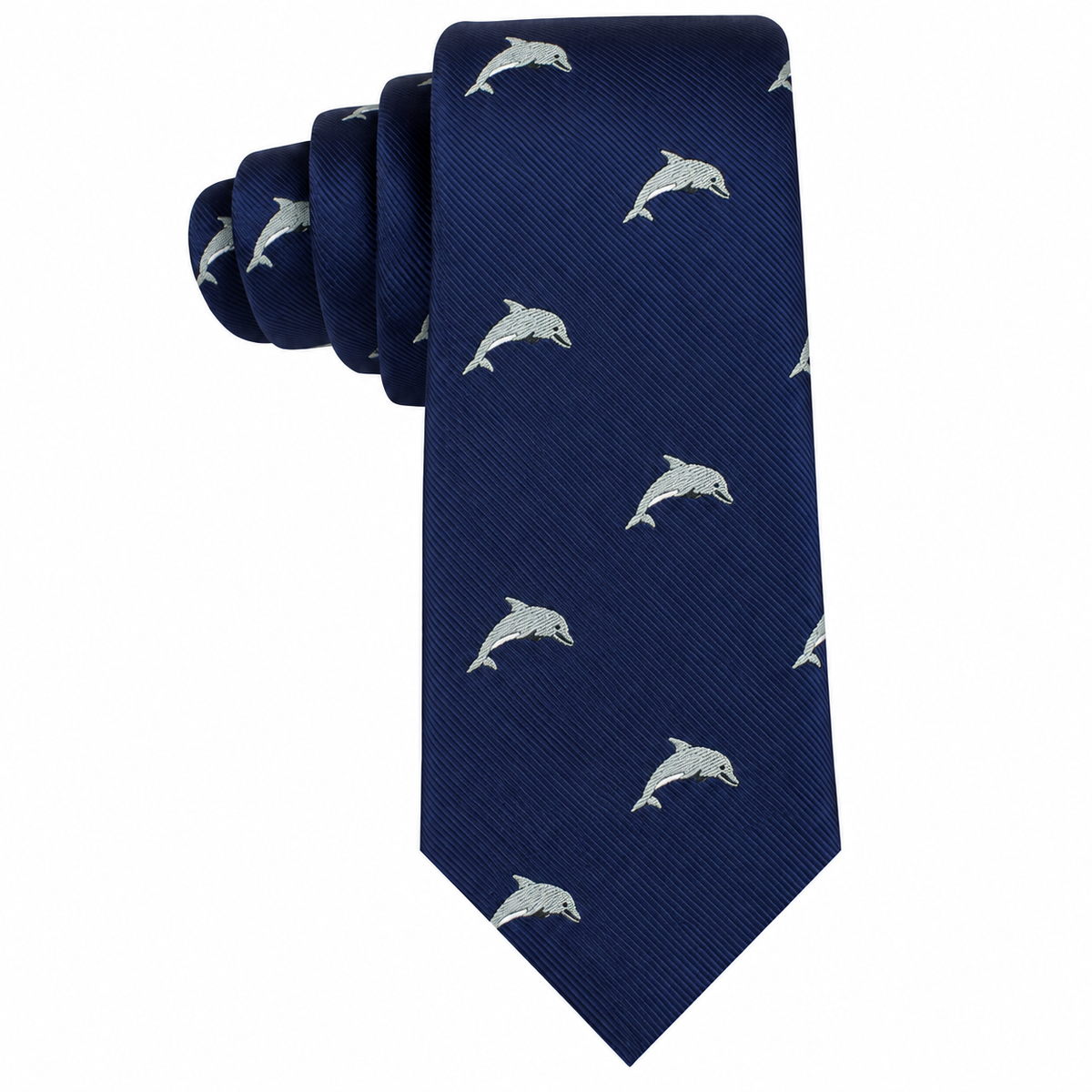 The Dolphin Skinny Tie, shown rolled up at the top against a white background, features a navy blue design adorned with a repeating pattern of small, light-colored dolphins for a marine-inspired look.