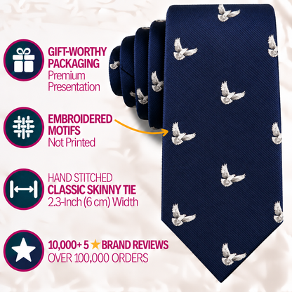 Introducing the Dove Skinny Tie in navy blue, featuring delicate hand-stitched white dove embroidery and a sleek 6 cm width. Presented in gift packaging and praised with premium reviews, this meaningful necktie effortlessly elevates any outfit with elegance and symbolic style. Perfect for those seeking a refined white dove print tie to add significance to their look.