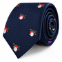 The Drums Skinny Tie features a navy blue background adorned with small red drum sets, displayed in a rolled position—making this percussion-themed accessory the perfect gift for any music lover.