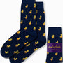 The Duck Socks, featuring a navy blue background with a lively yellow duck design, add standout style to your outfit. These delightful socks come packaged with "AusCufflinks Australia" branding, ensuring you waddle through the day with flair and confidence.